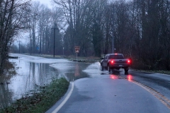 Truck driving on flooded road in Everett, Washington